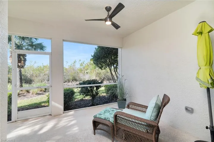 Sunroom with ceiling fan and healthy amount of natural light