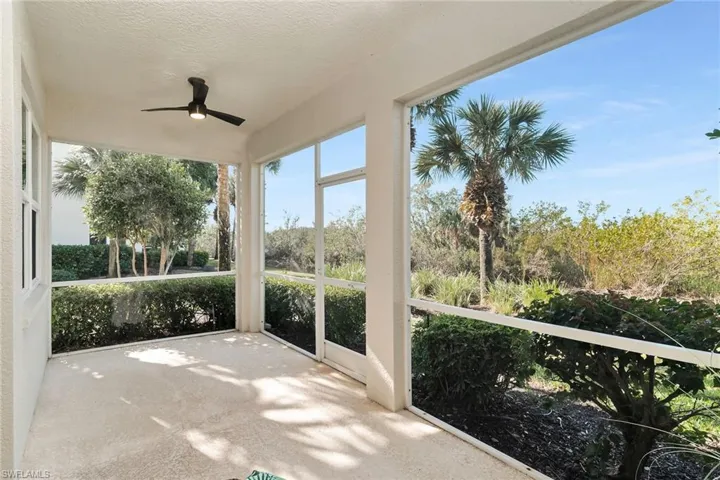 Unfurnished sunroom with a ceiling fan