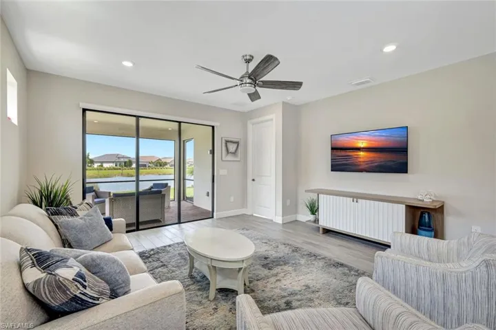 Living room featuring featuring tile flooring and ceiling fan