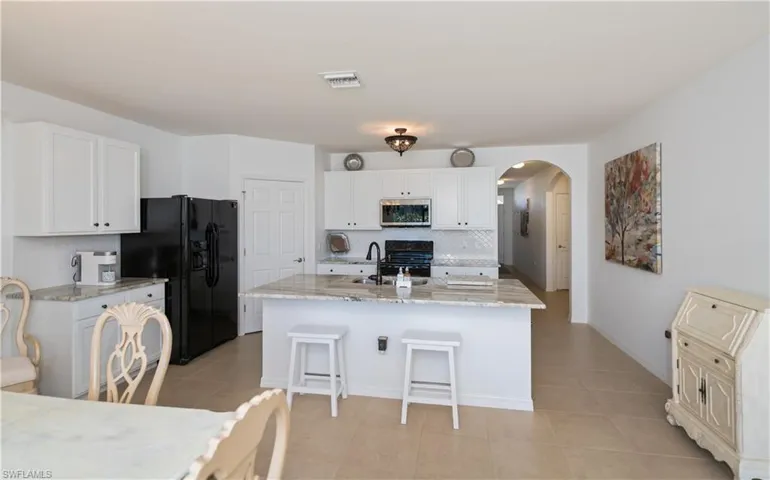 looking from dining table back to kitchen