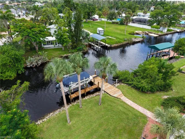Drone / aerial view of a large body of water and a tree filled landscape