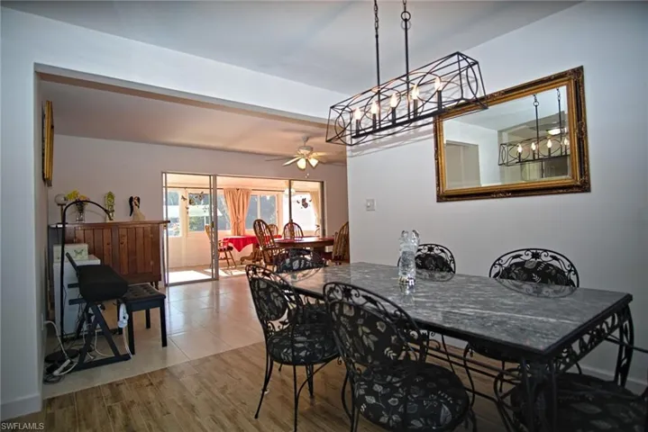 Dining room featuring wood finished floors and a ceiling fan