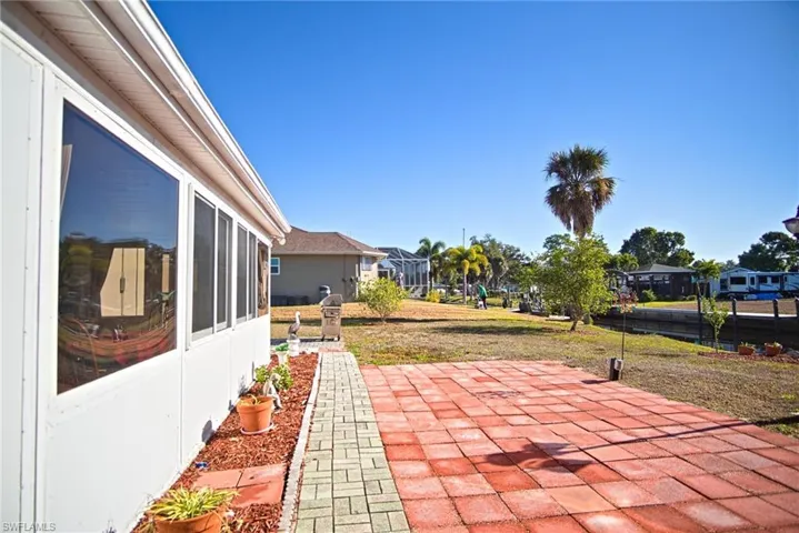 View of patio / terrace featuring a residential view and a sunroom