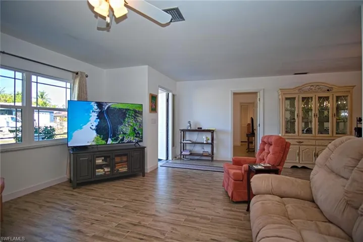 Living area with a ceiling fan.