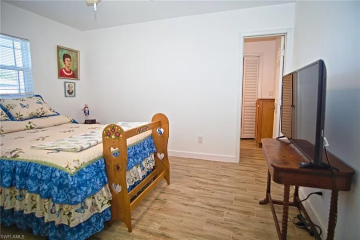 Bedroom featuring porcelain tile. Has his and her walk in closet.
