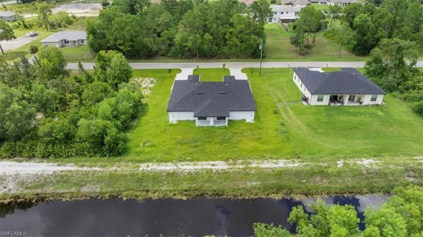 View from above of property with a large body of water