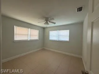 1 BR Bedroom with a ceiling fan and plenty of natural light