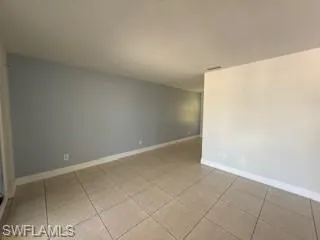 1 BR Living room with light tile patterned flooring