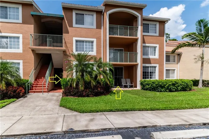 View of apartment building / complex featuring stairs