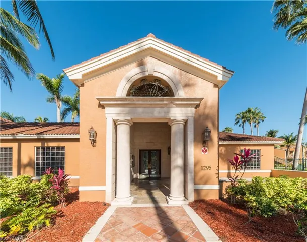 Entrance to property with stucco siding and french doors