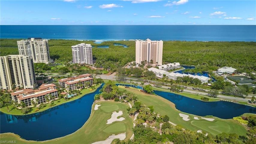Club Pelican Bay, golf course, nestled within our neighborhood.  The Dorchester is the high rise in the middle.