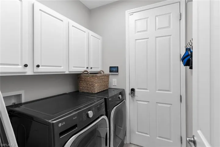 Laundry room featuring cabinet space and washing machine and dryer