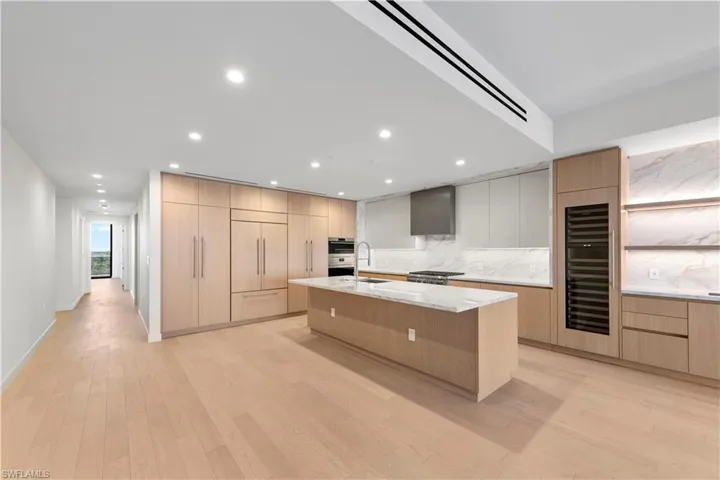 Italkraft Cabinetry, Polished Porcelain, ,Task Lighting, West Bar, 10' Island, 102 Bottle Dual Zone SubZero Wine Fridge