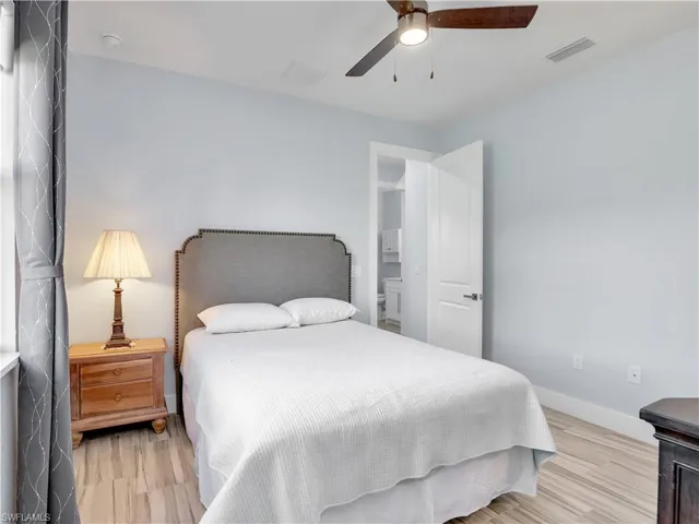 Bedroom featuring light wood-type flooring and ceiling fan