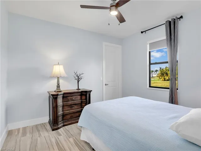 Bedroom featuring ceiling fan and light hardwood / wood-style floors