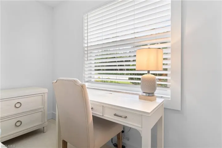 Home office featuring light tile patterned flooring