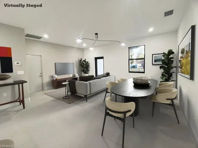 Dining room featuring baseboards and recessed lighting
