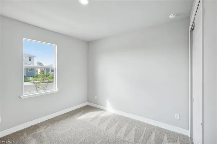 Spare room with carpet flooring