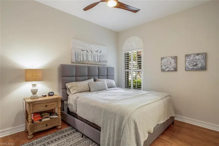 Bedroom featuring hardwood / wood-style flooring and ceiling fan