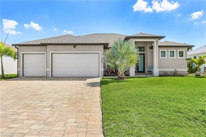 1503 NW 39th Ave, Cape Coral FL   2019 Gulf Access Pool Home, 2,279 Sq Ft, 3 Bedroom plus Den, 3 bath, open split floor plan, outdoor kitchen, large lanai, pool and jacuzzi, 3 car garage