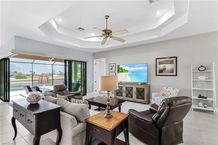 open split floor plan, view of lanai and pool area,