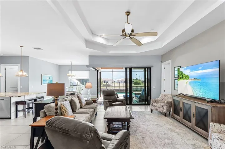 open split floor plan, view of lanai and pool area,