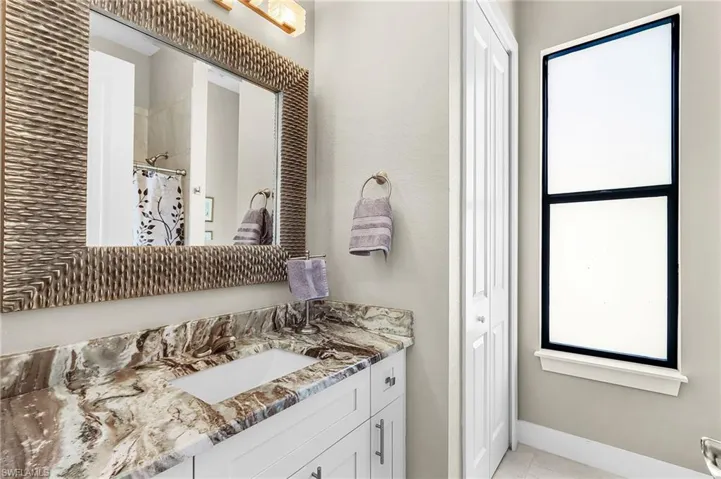 guest bath, with linen closet and shower