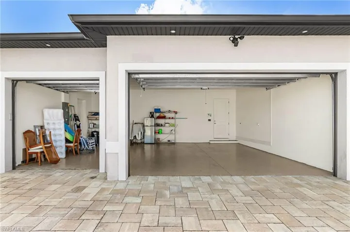 3 Car garage with man door at side, epoxy Floors