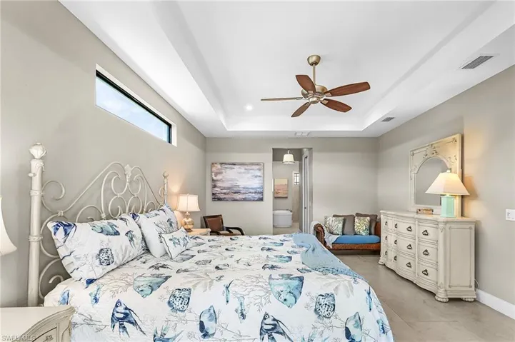 Large suite, 2 walk-in closets, entry into lanai pool area, dual vanities, soaking tub, private toilet, large storage closet, large walk-in shower