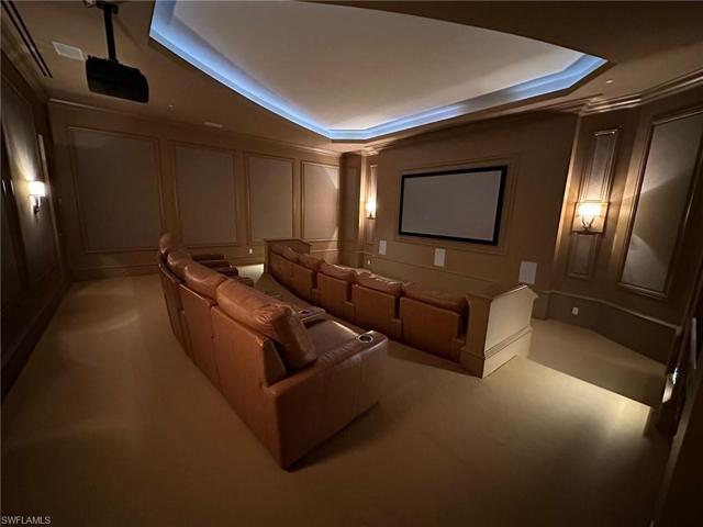 The movie theater in the amenity center has comfy reclining seats.