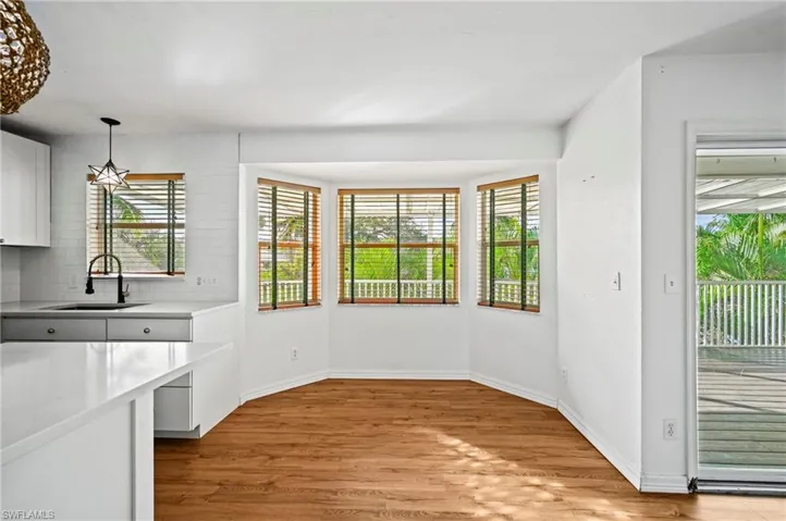 Unfurnished dining area with light wood-type flooring and plenty of natural light