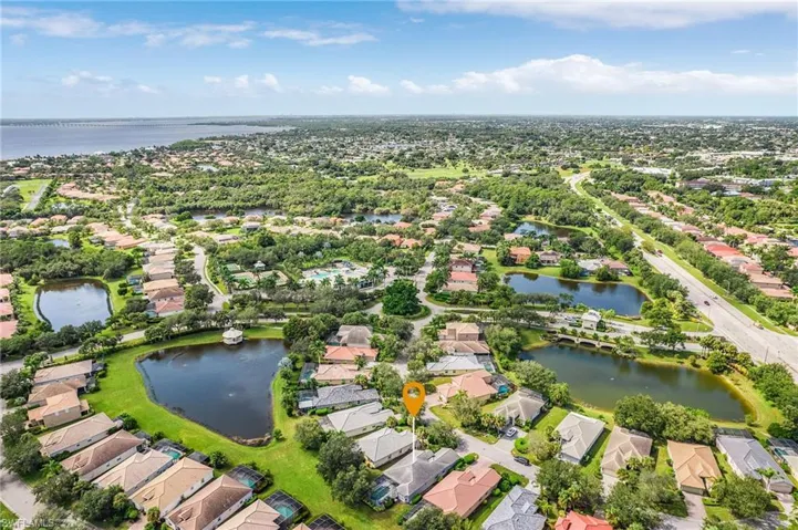 Aerial view of residential area featuring a large body of water