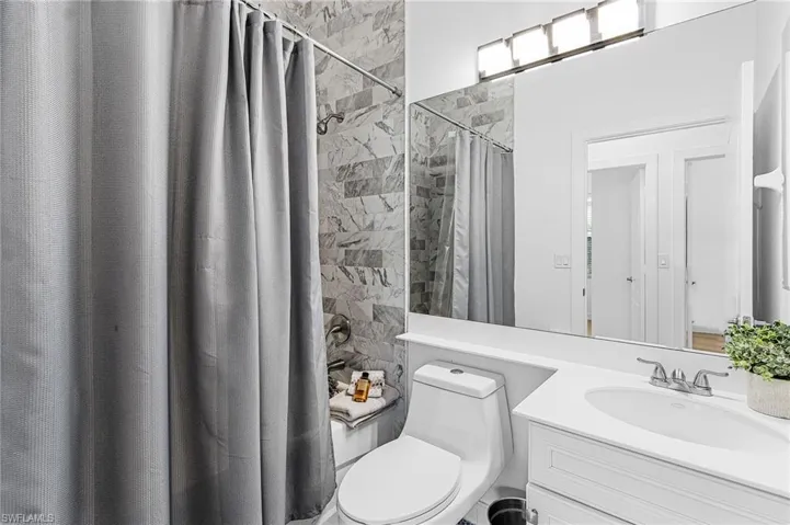 Full bath with vanity and toilet