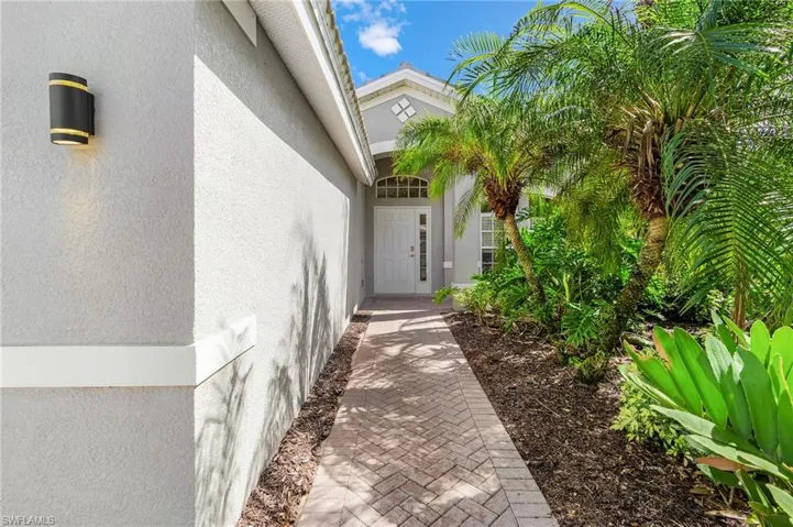 Entrance to property featuring stucco siding