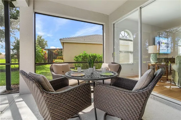 Sunroom featuring outdoor dining area