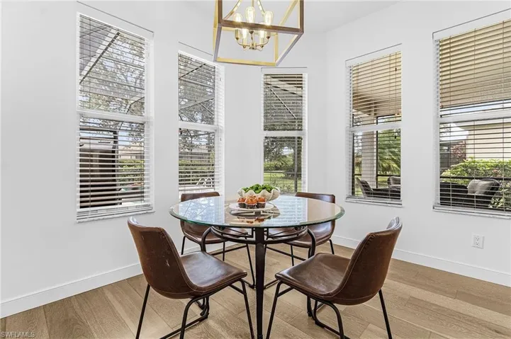 Dining area featuring a chandelier and wood finished floors