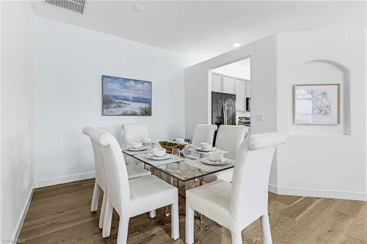 Dining room featuring light wood finished floors and recessed lighting