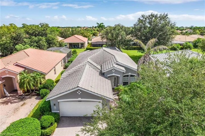 Aerial perspective of suburban area with a tree filled landscape