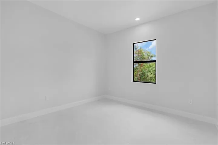 Unfurnished room with recessed lighting and concrete floors