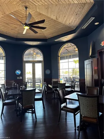 Spacious interior featuring a wood-finish vaulted ceiling with a ceiling fan