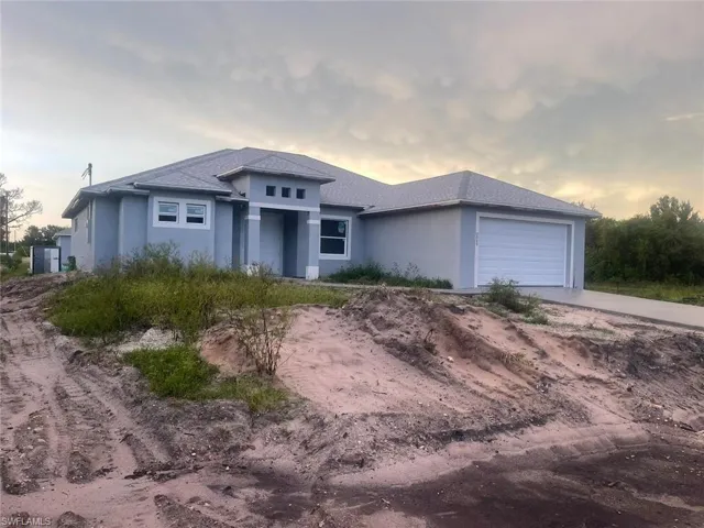 Prairie-style house featuring a garage