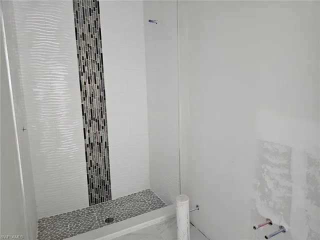 Bathroom with a tile shower