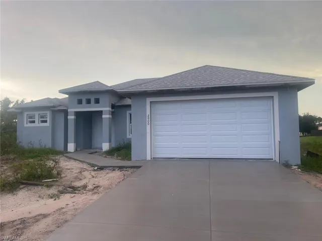 Prairie-style home featuring a garage