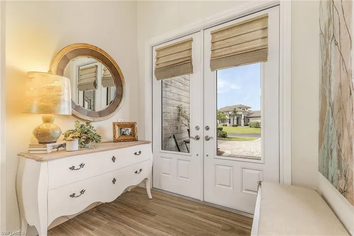 Entryway with french doors and light wood-type flooring