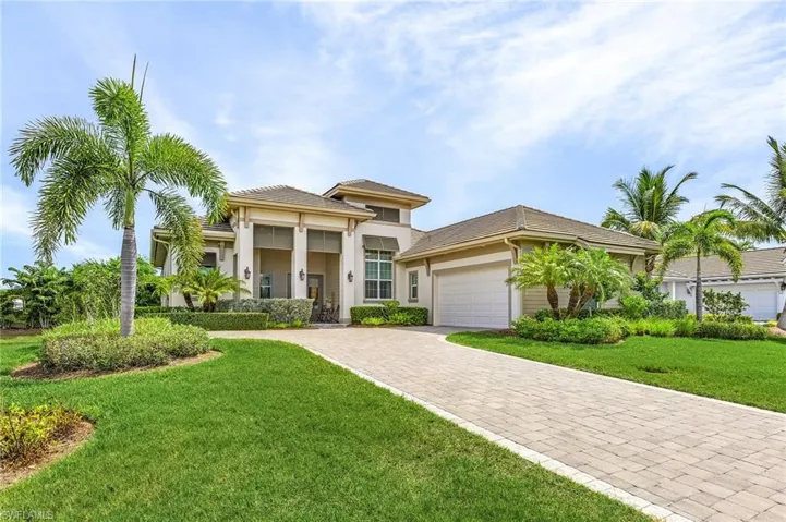 View of front facade with a garage and a front yard