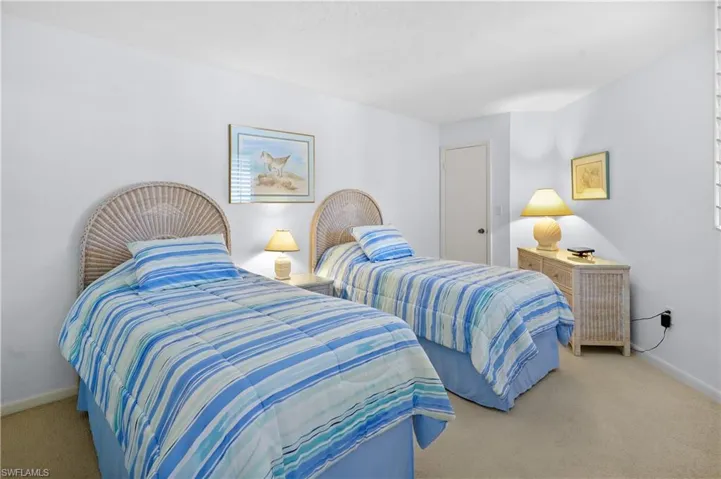 Carpeted bedroom with baseboards