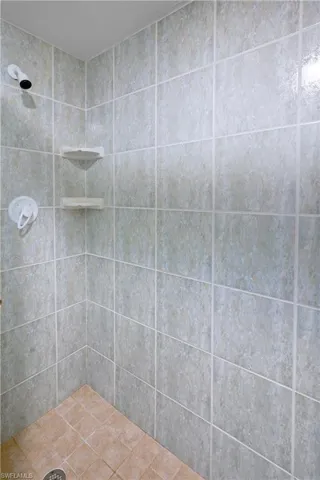Bathroom featuring tiled shower