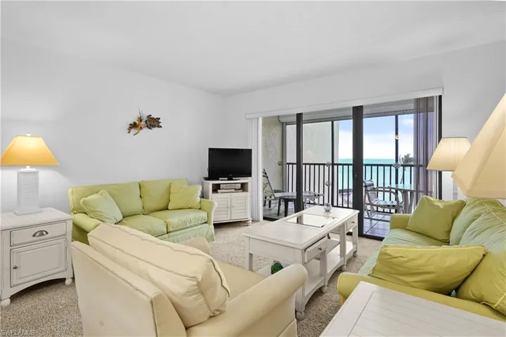 Living area featuring light colored carpet