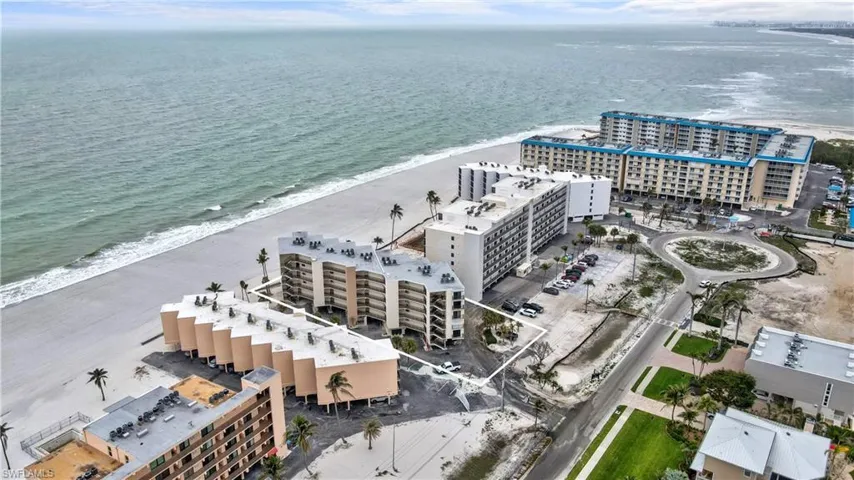 Drone / aerial view featuring a city view, a beach view, and a water view