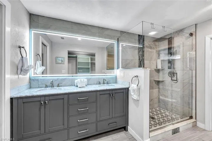 Enjoy this luxuriously updated primary bathroom.